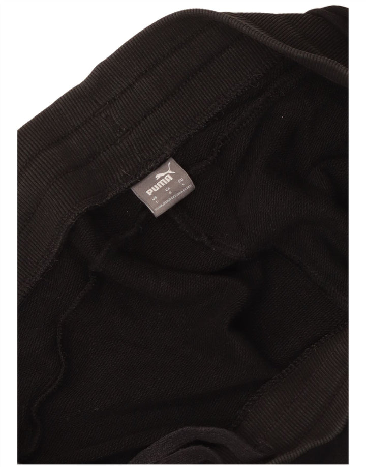 Shorts esportivos femininos Puma UK 16 grandes pretos