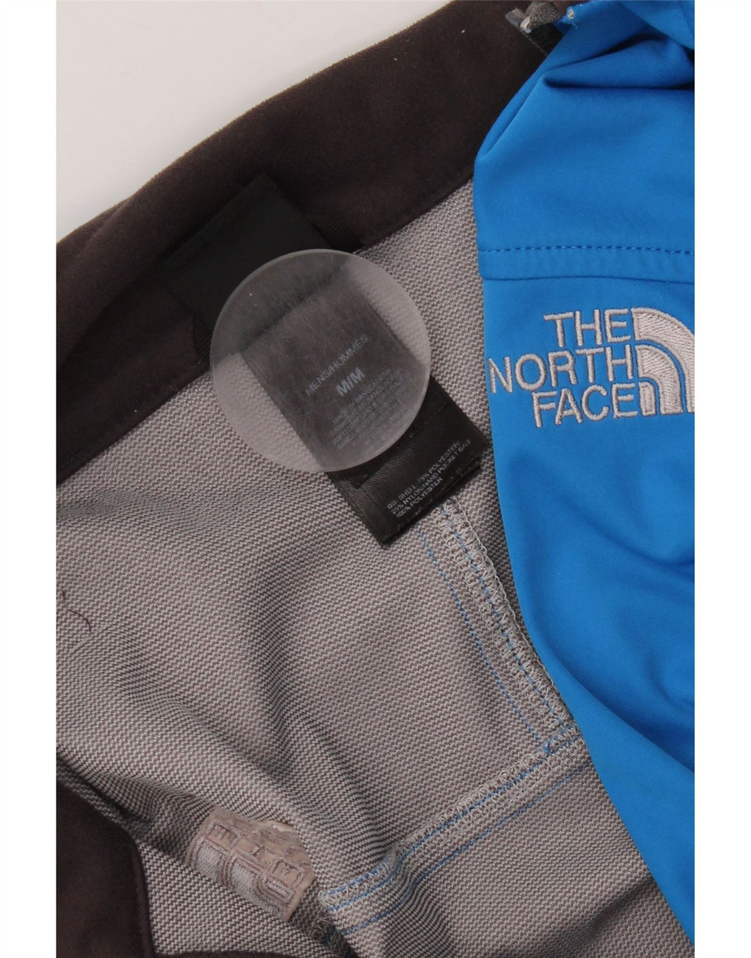 Jaqueta masculina de moletom The North Face em poliéster colorblock azul médio
