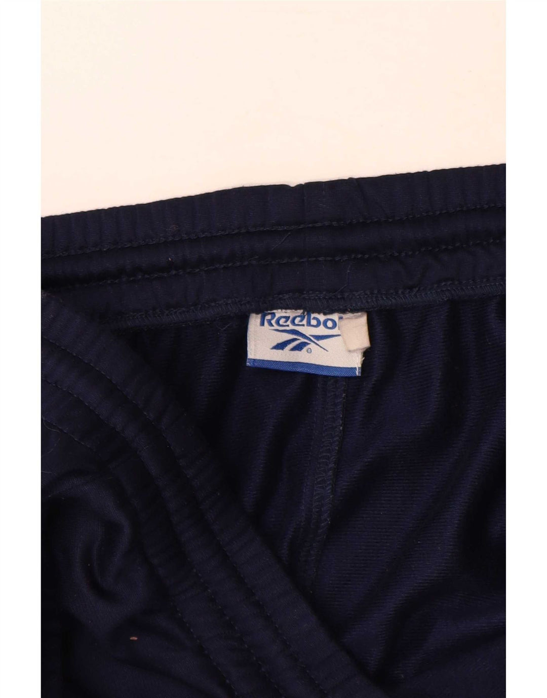Calça de treino masculina Reebok XL azul marinho colorblock