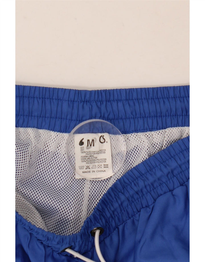 Calça de treino masculina Asics médio azul colorblock poliéster
