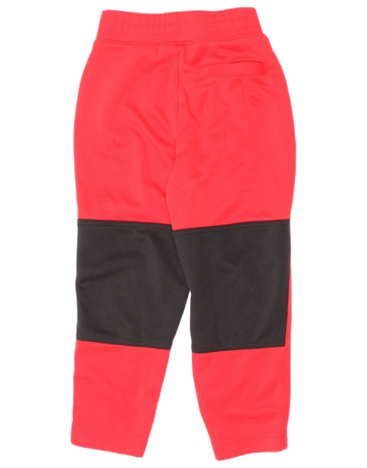 Calça de treino Nike Boys Graphic 3-4 anos vermelho colorblock