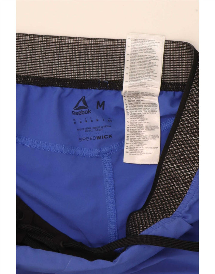 Shorts esportivos gráficos masculinos Reebok médio azul colorblock poliéster