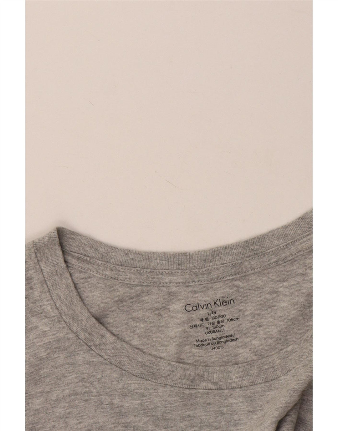 Camiseta masculina Calvin Klein grande cinza manchada
