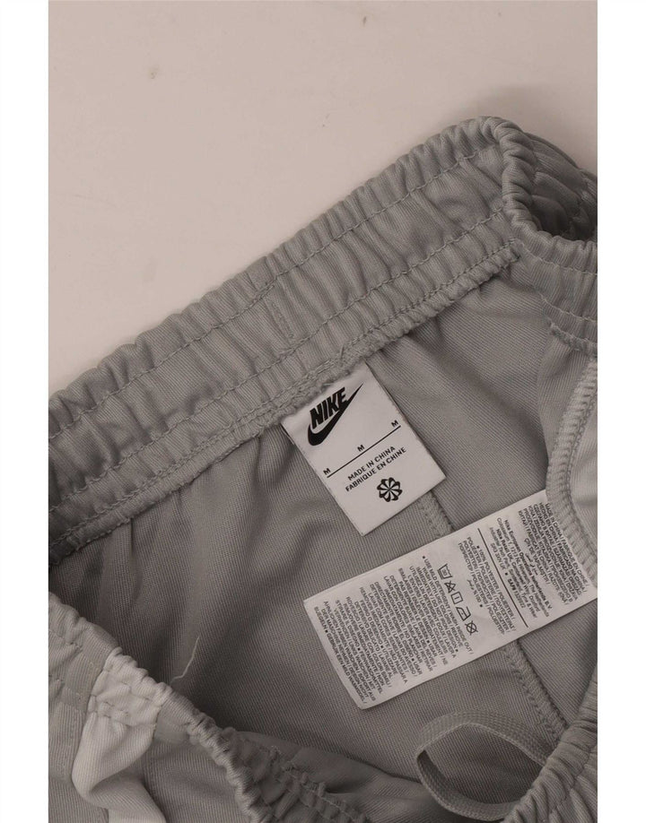 Calça de treino masculina Nike Graphic Joggers cinza médio colorblock