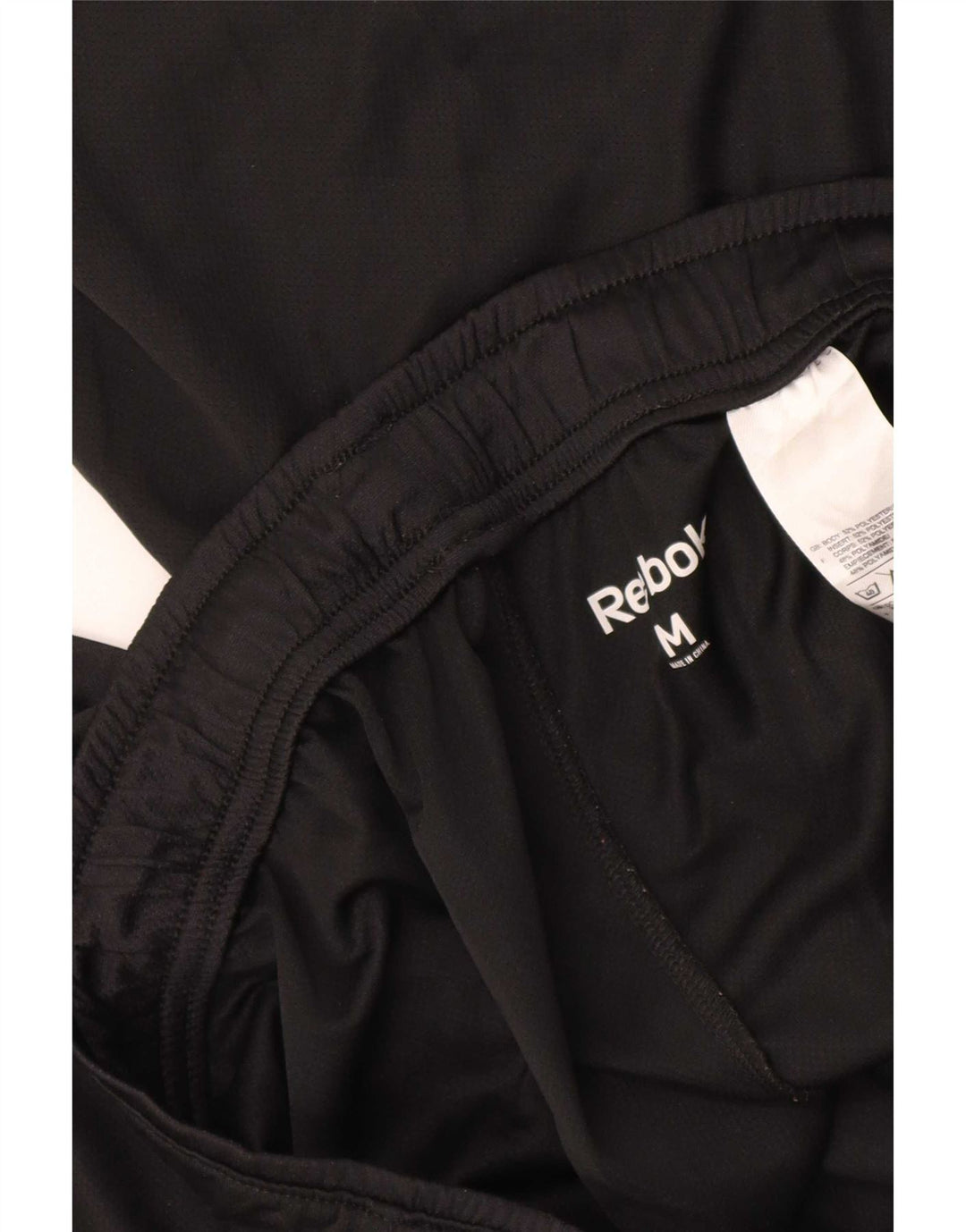 Shorts esportivos masculinos Reebok médio preto poliéster