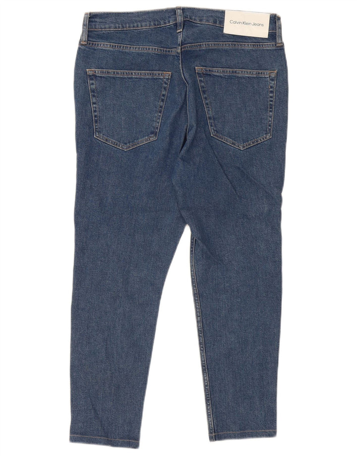 Calça jeans masculina Calvin Klein cortada W32 L25 algodão azul
