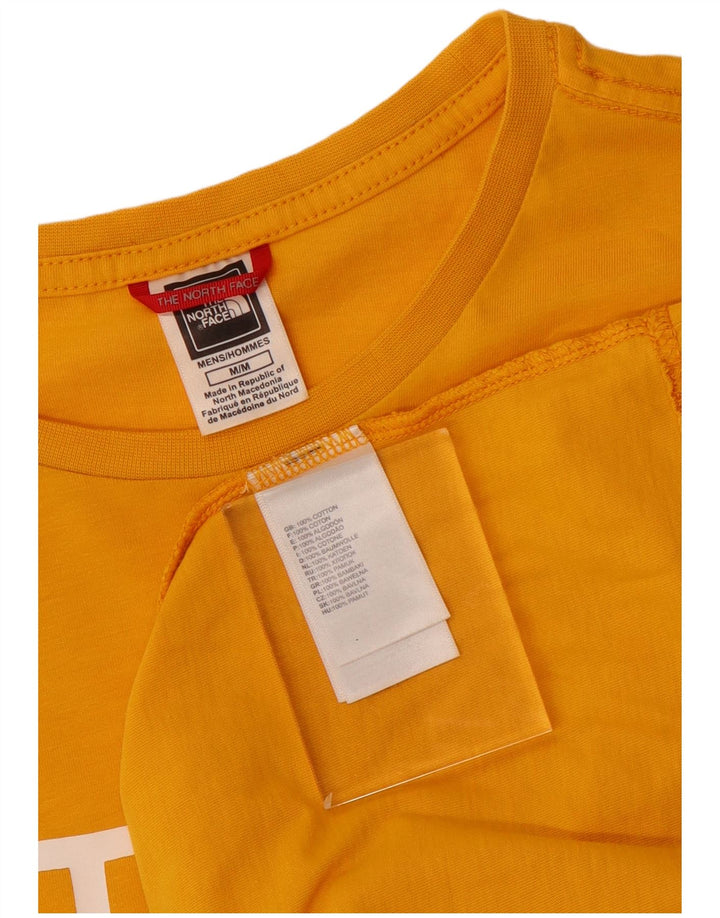 Camiseta gráfica masculina The North Face algodão amarelo médio