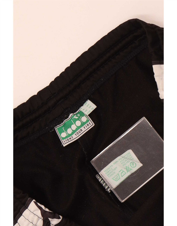 Calça de treino masculina Diadora Graphic grande poliéster colorblock preto