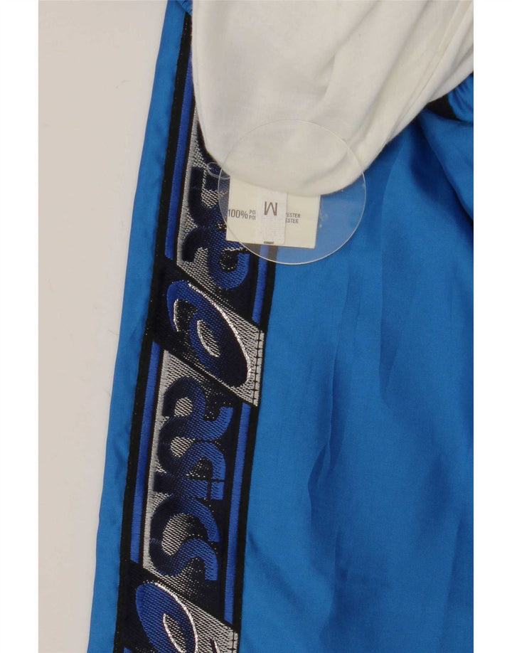Calça de treino masculina Asics Graphic azul médio colorblock poliéster