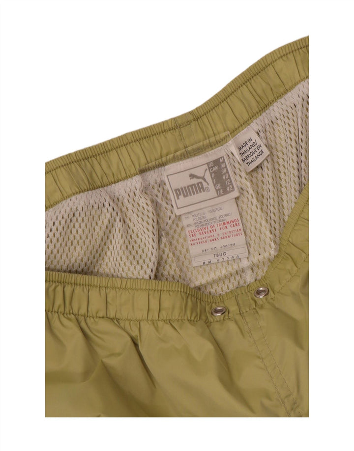 Calça de treino feminina Puma UK 12 poliéster verde médio