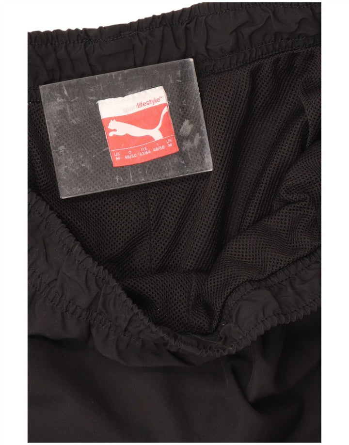 Calça de treino masculina PUMA Graphic Capri médio preto
