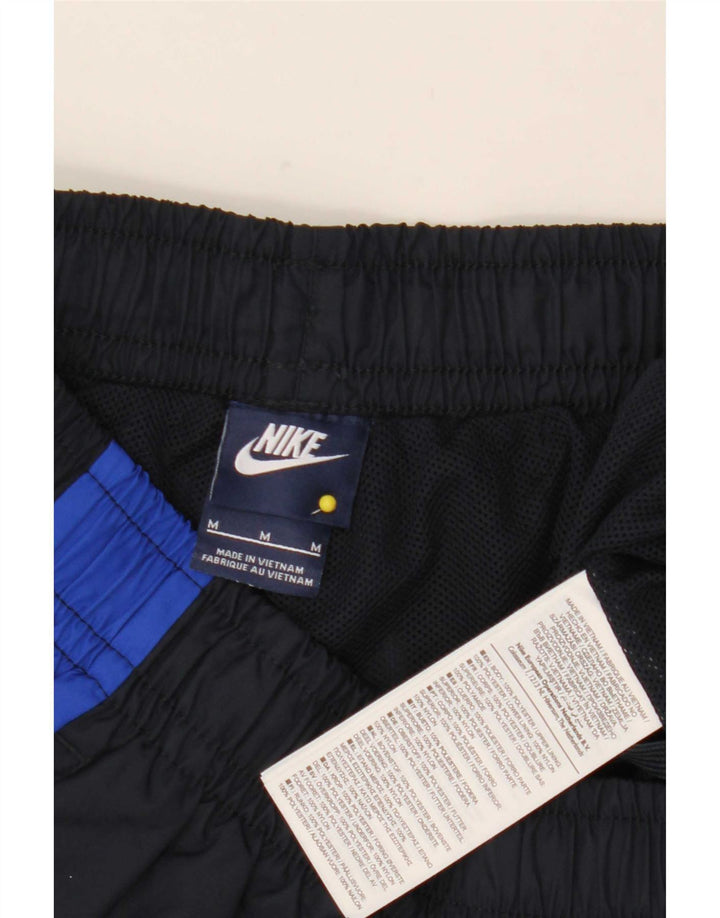 Calça de treino masculina Nike médio azul marinho colorblock poliéster