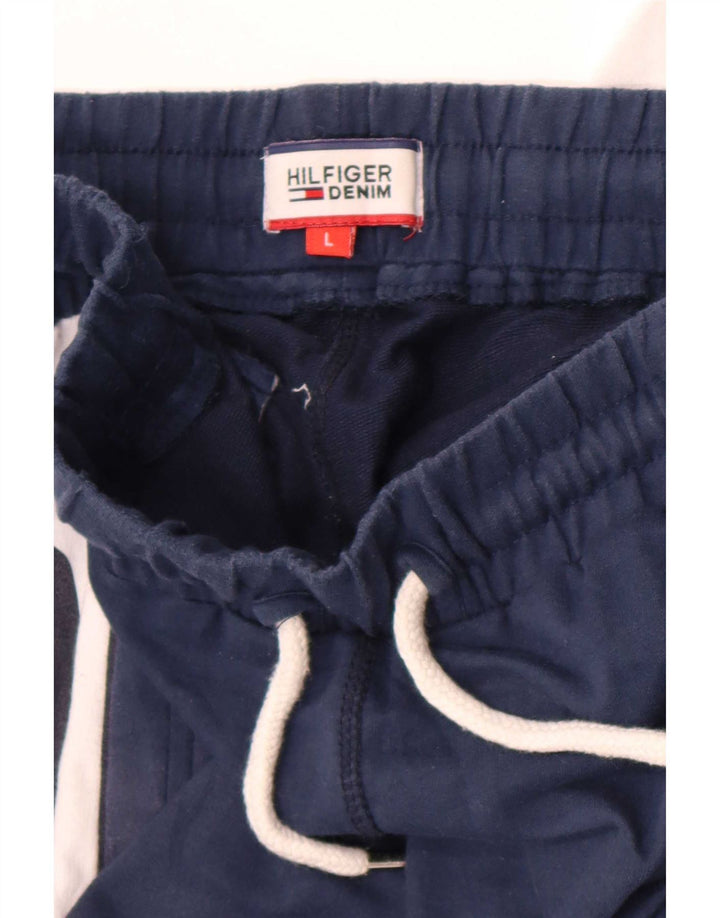 Calça de treino masculina Tommy Hilfiger com estampa gráfica grande bloco colorido azul