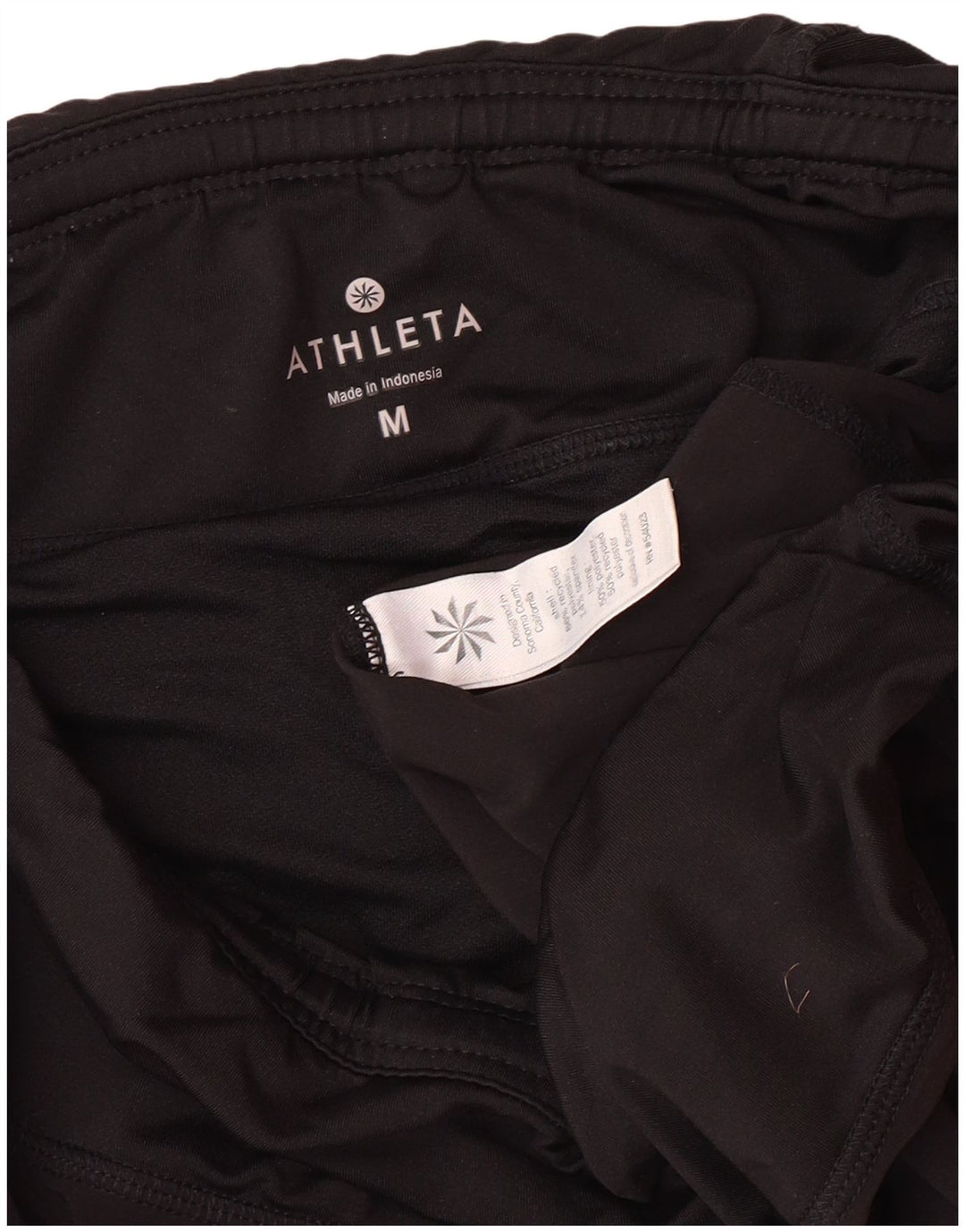 Shorts esportivos femininos ATHLETA UK 12 poliéster preto médio