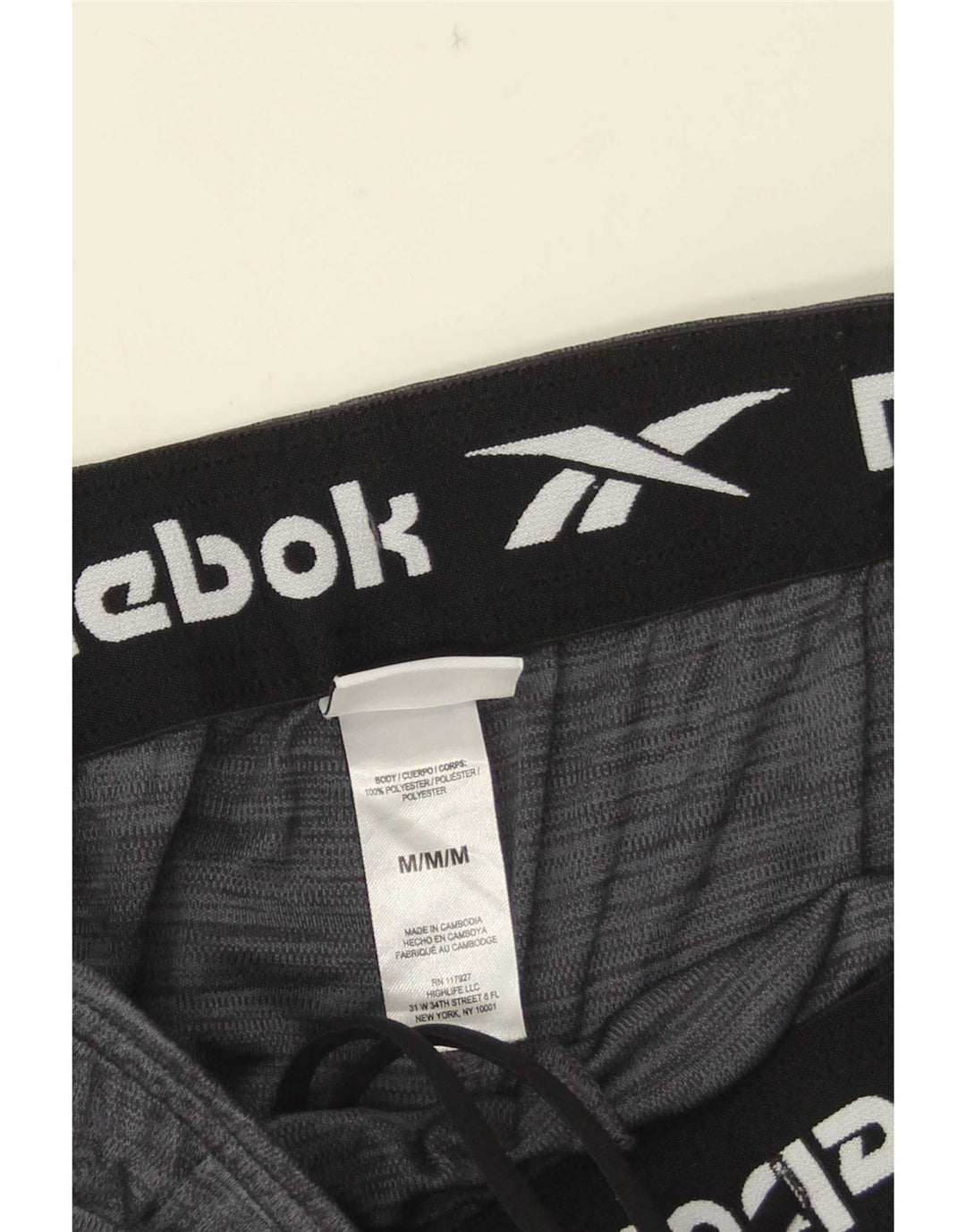 Shorts esportivos masculinos Reebok poliéster cinza médio