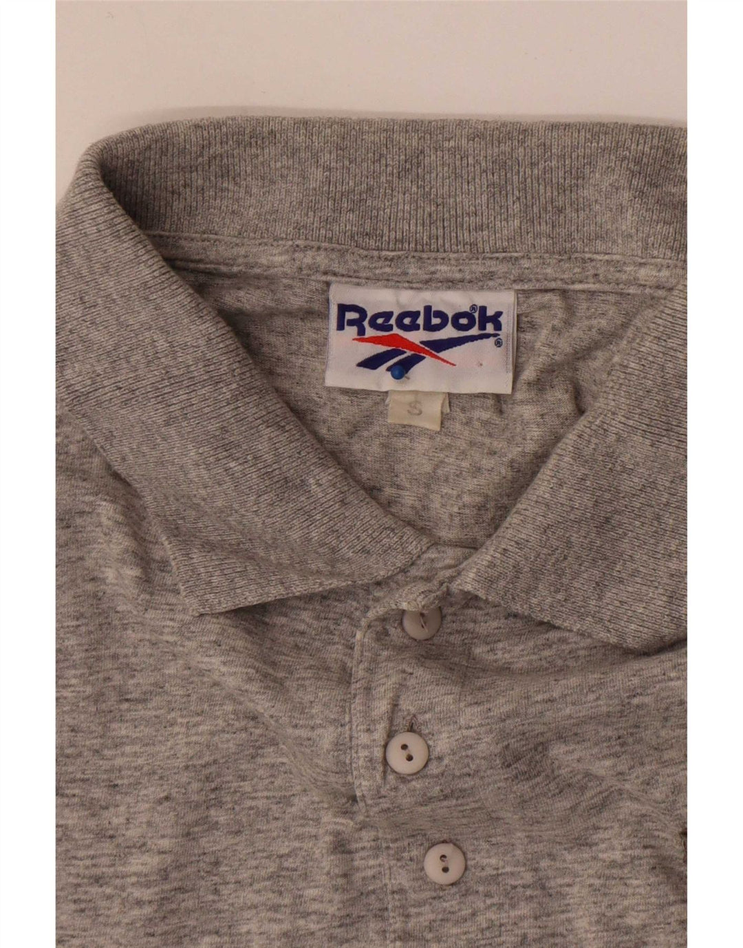 Camisa polo masculina Reebok pequena cinza manchada