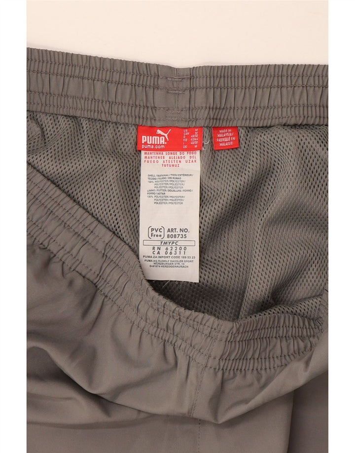 Calça de treino masculina Puma Graphic Capri cinza médio poliéster