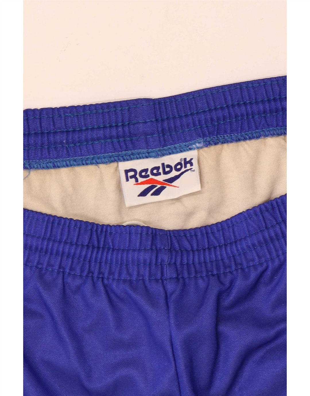 Shorts esportivos masculinos Reebok grande bloco colorido azul