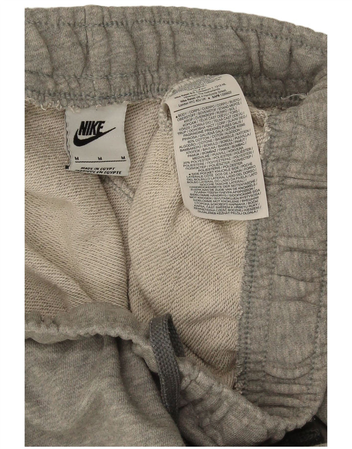 Calça de treino Nike masculina Graphic Cargo Joggers de algodão cinza médio