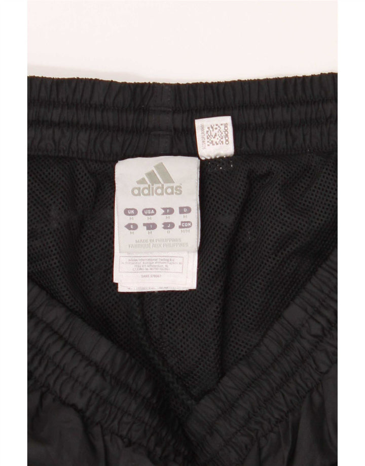 Calça de treino masculina Adidas médio preto colorblock poliéster