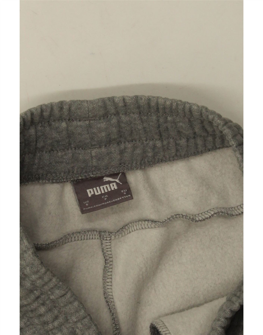 Calça esportiva masculina Puma Joggers pequena cinza manchada