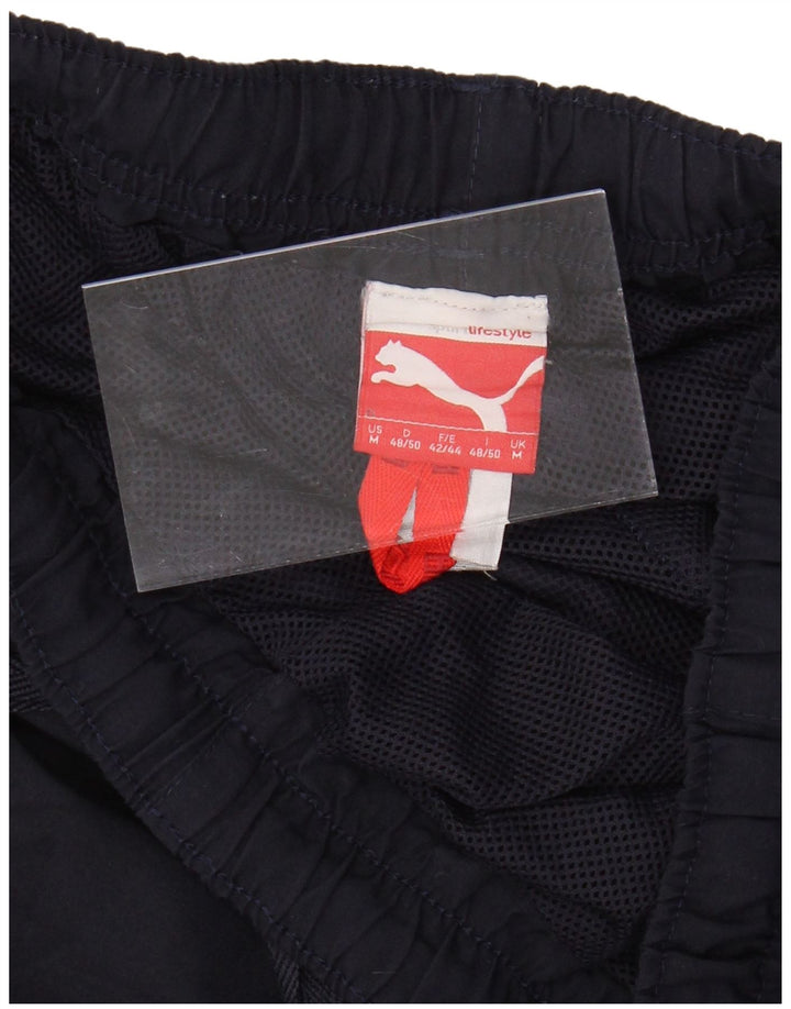 Calça de treino masculina PUMA Graphic Joggers médio azul marinho