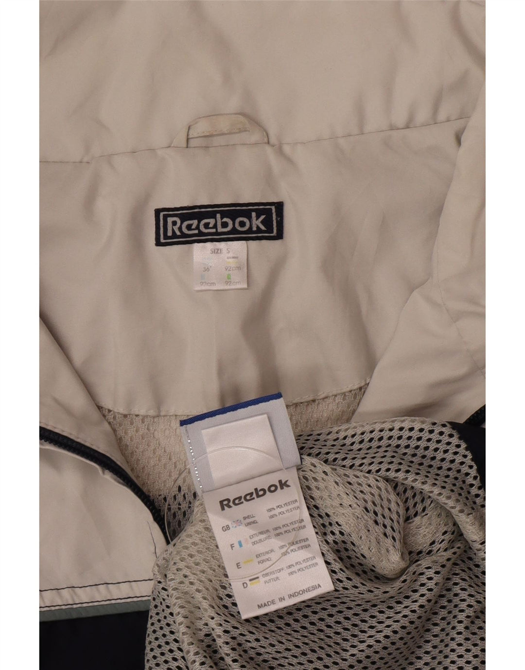 Jaqueta de chuva masculina REEBOK pulôver Reino Unido 36 pequeno bloco colorido azul marinho