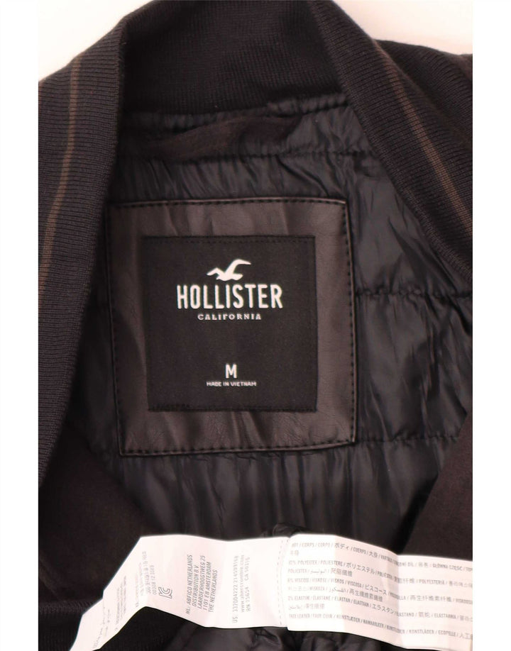 Jaqueta masculina Hollister Graphic Varsity UK 38 poliéster preto médio
