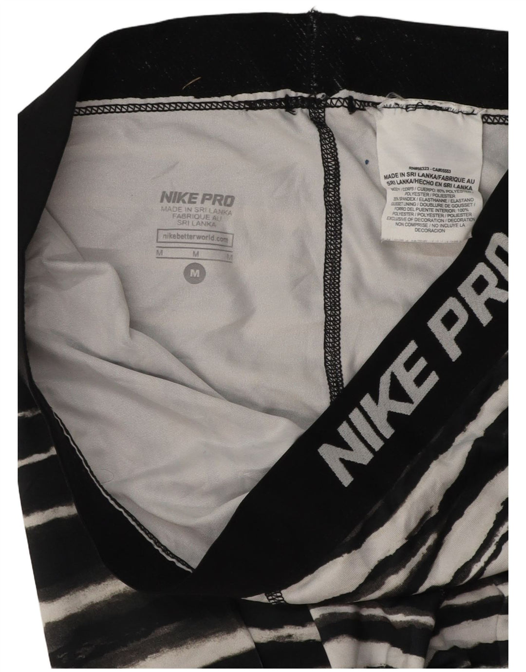 Calça de treino Nike feminina gráfica Capri UK 12 médio preto listrado