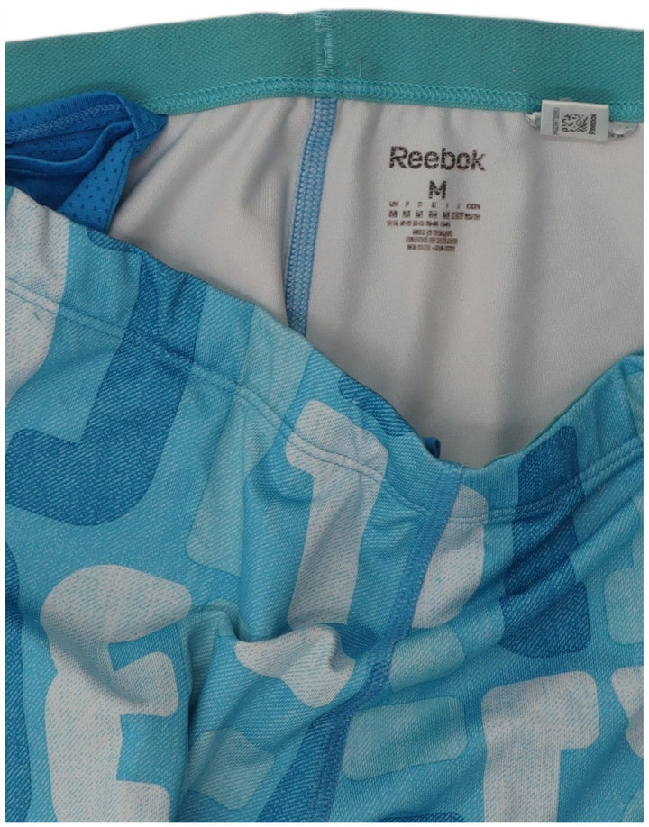 Calça feminina REEBOK com estampa gráfica UK 12 bloco colorido azul médio