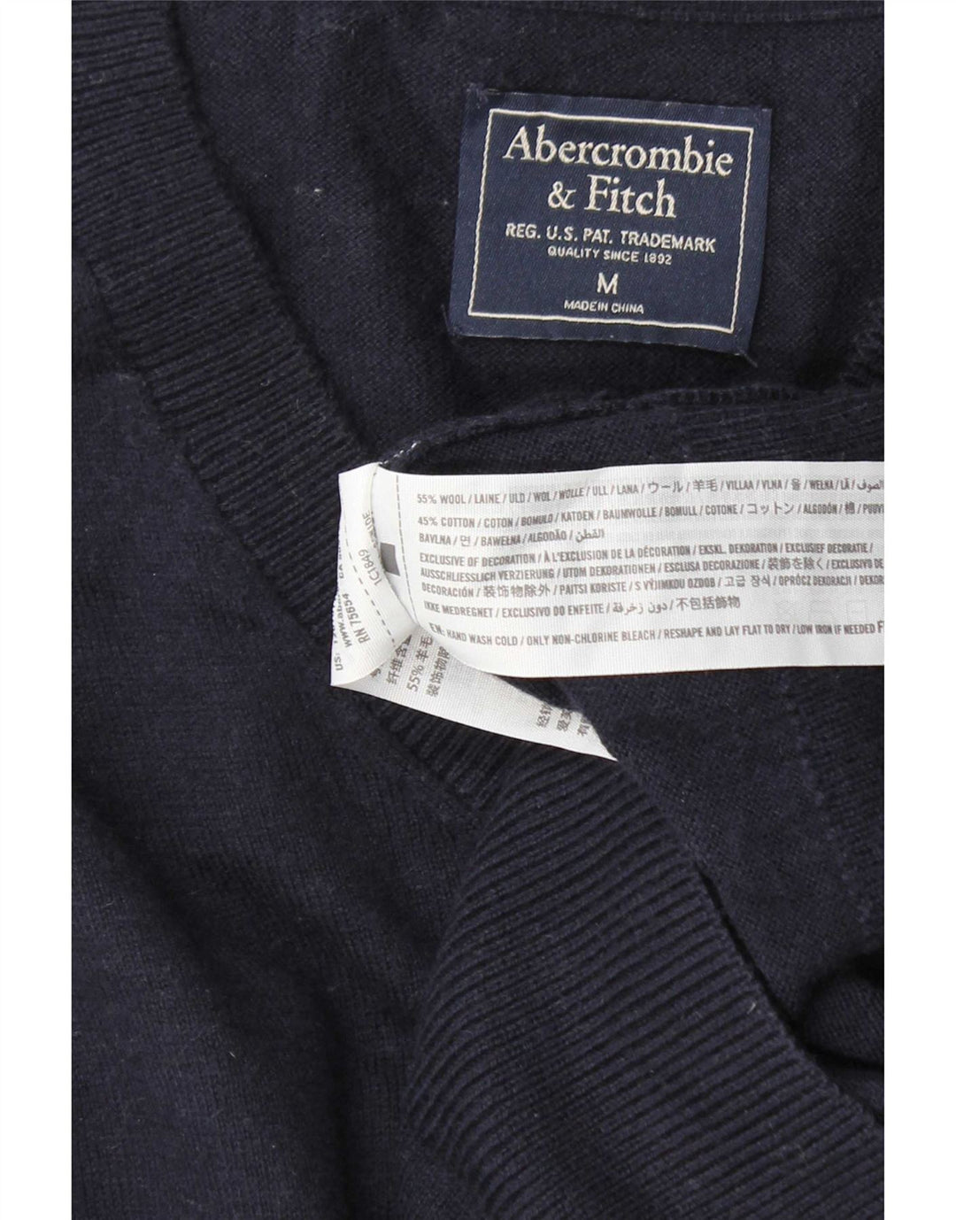 Suéter masculino Abercrombie & Fitch com decote em V de lã azul marinho médio