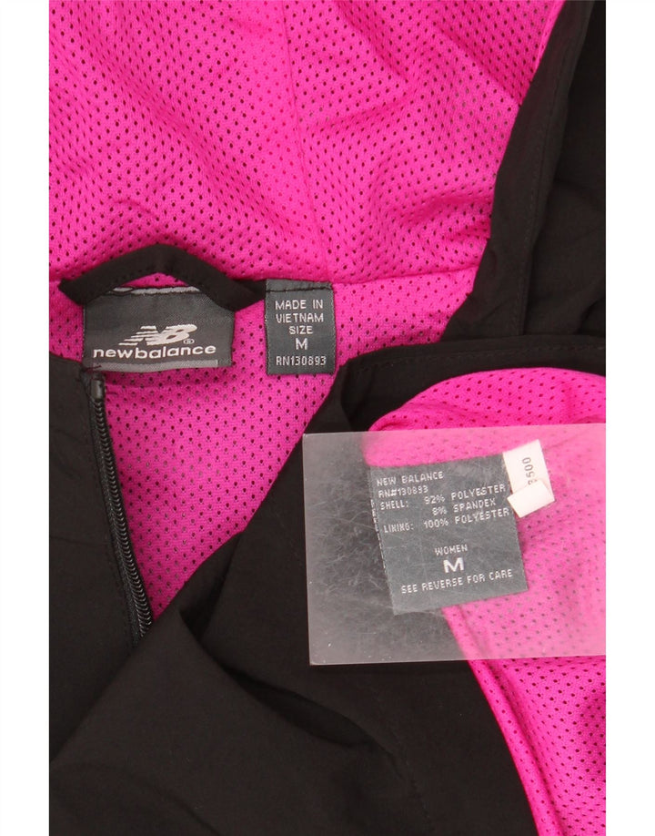 Capa de chuva com capuz feminino New Balance UK 14 poliéster preto médio