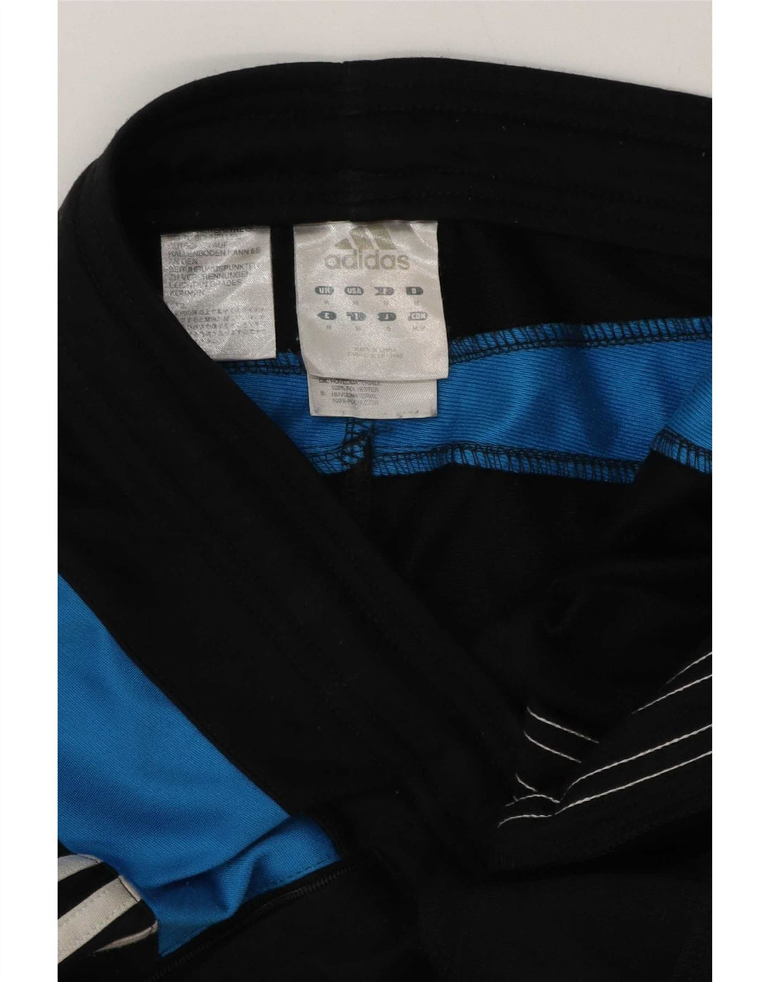 Calça de treino masculina Adidas médio preto colorblock poliéster