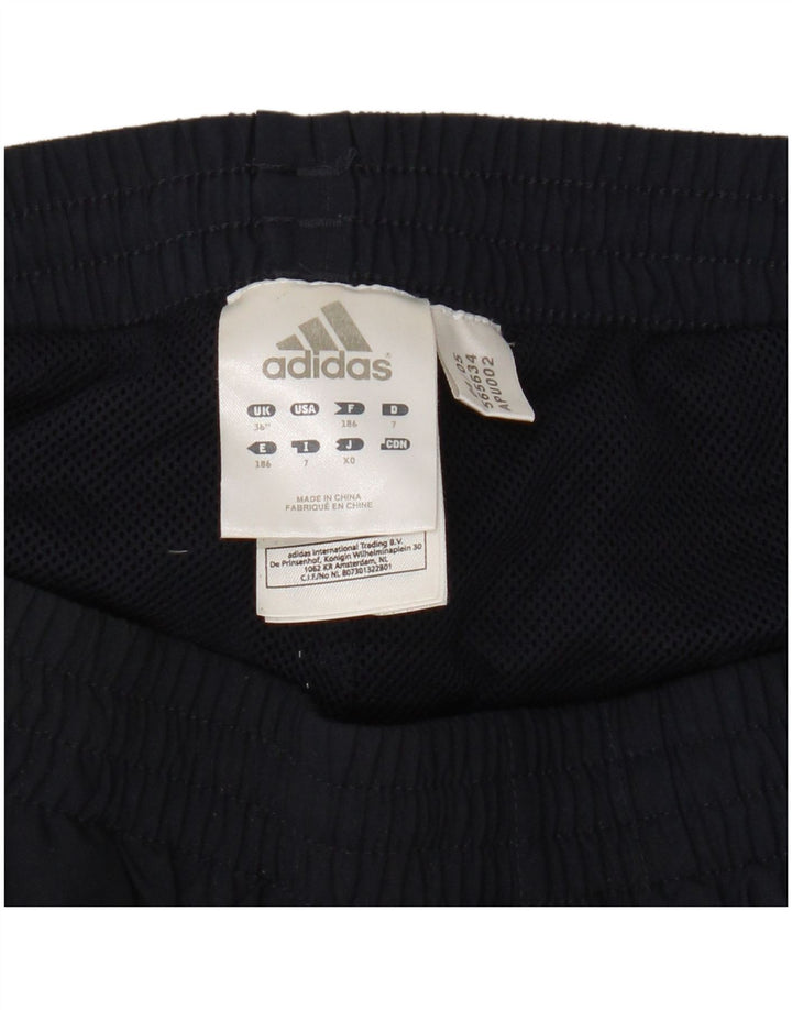 Calça de treino masculina Adidas grande poliéster azul marinho