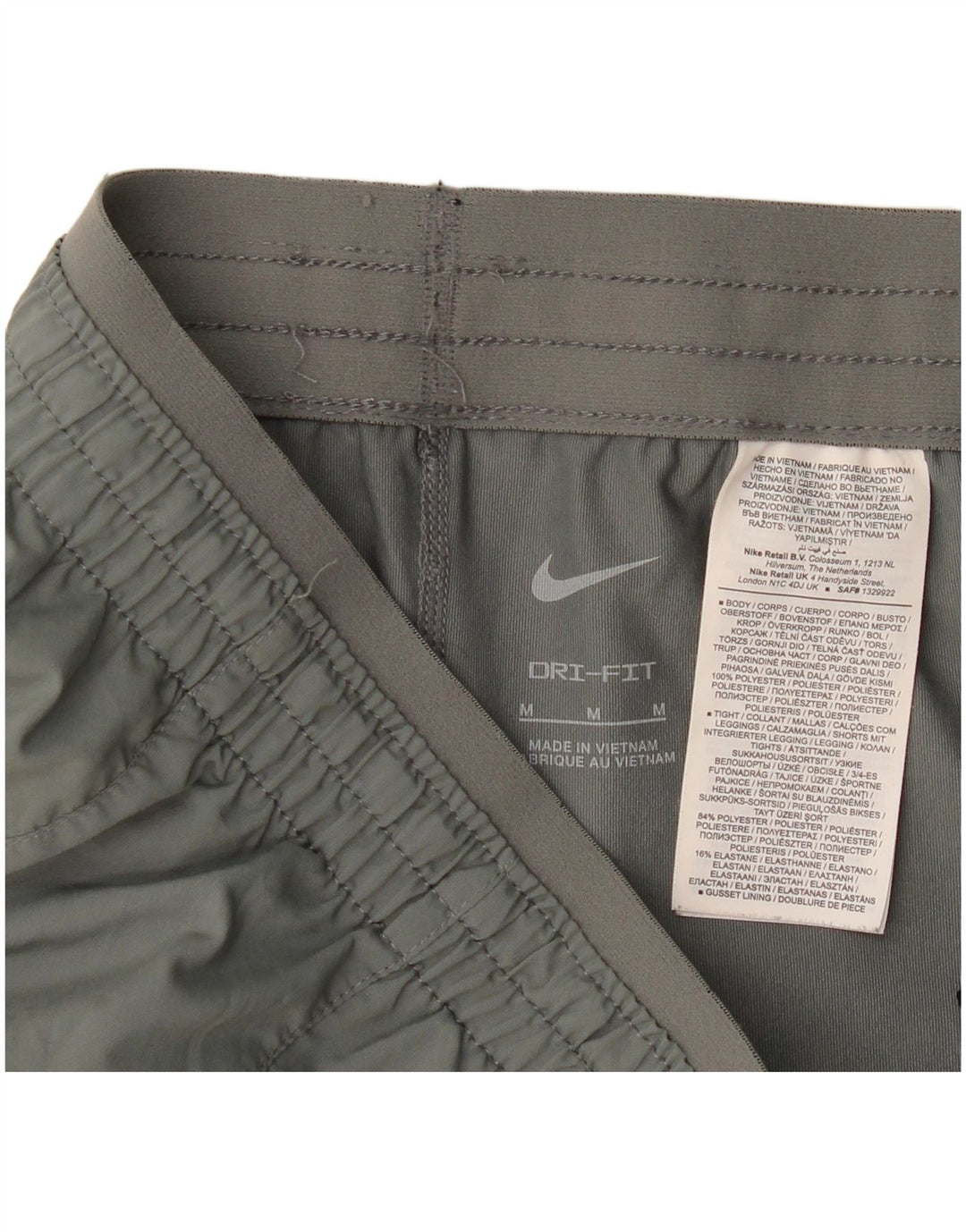 Shorts esportivos femininos Nike Dri Fit UK 14 poliéster cinza médio