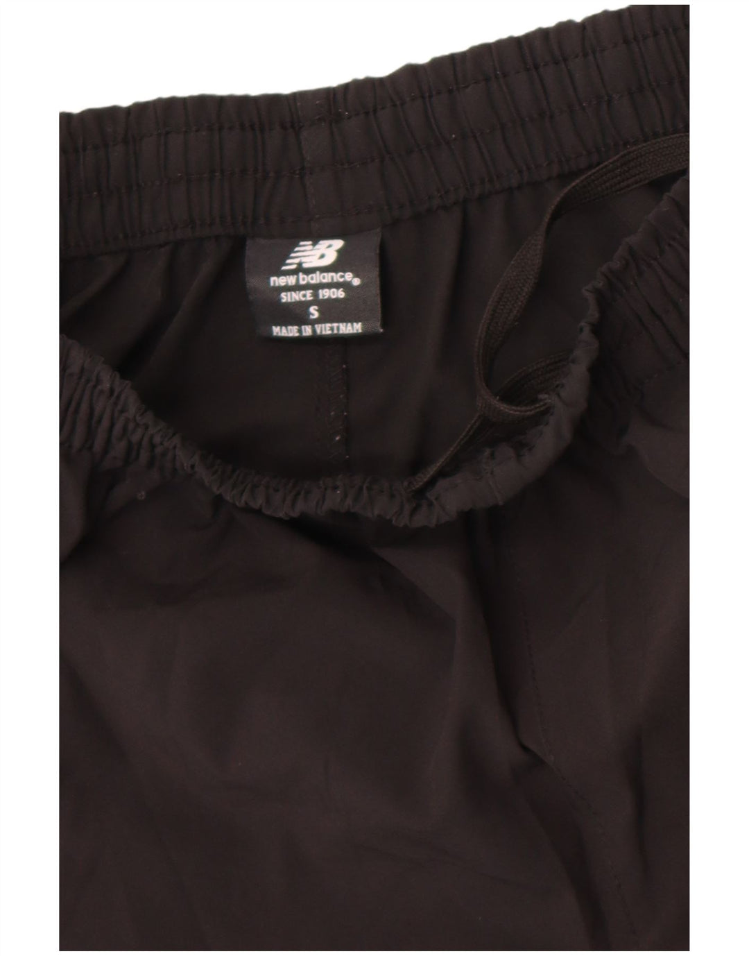 Calça esportiva masculina New Balance com estampa gráfica pequena de poliéster preto