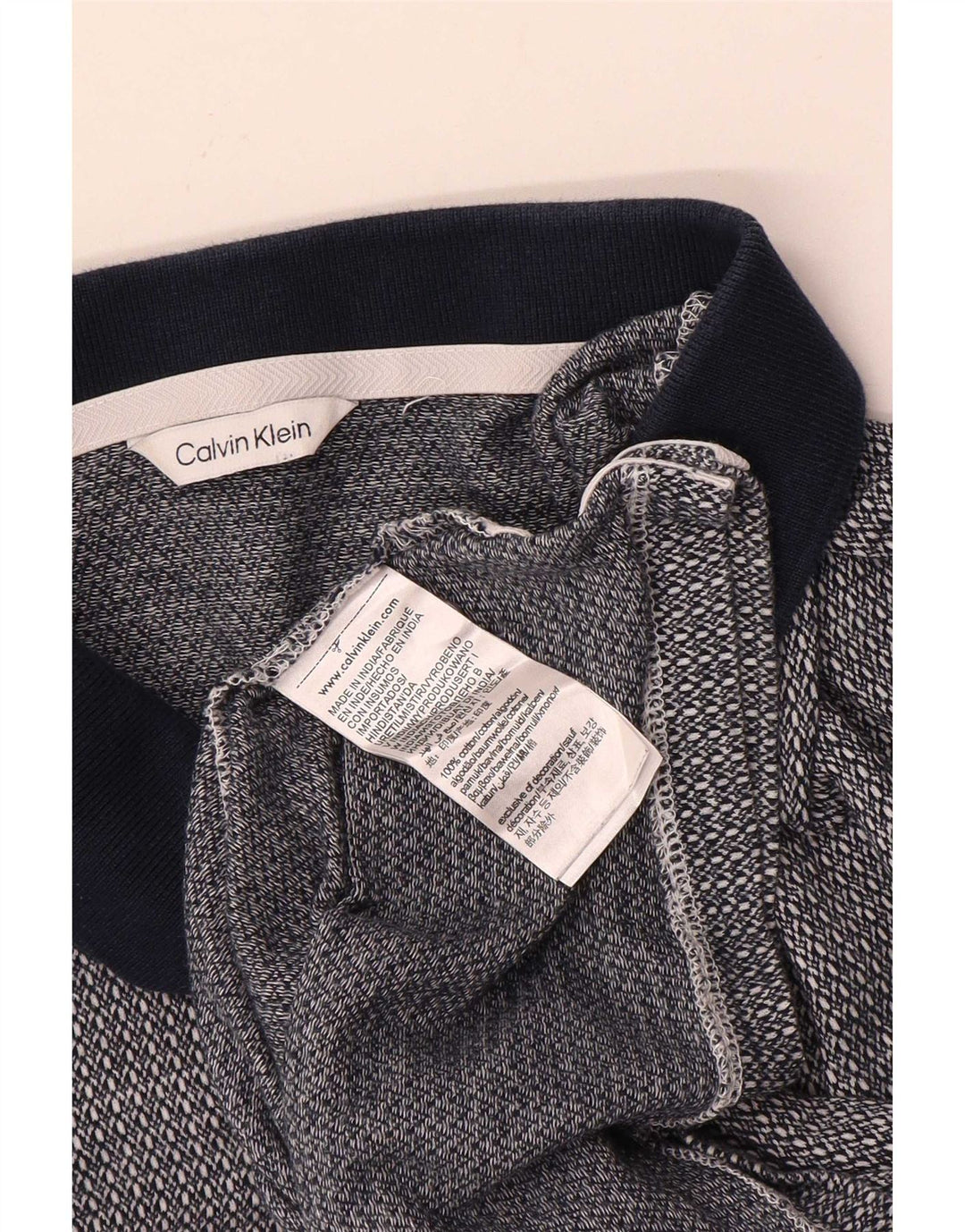 Camisa polo masculina de manga curta Calvin Klein azul marinho médio manchado
