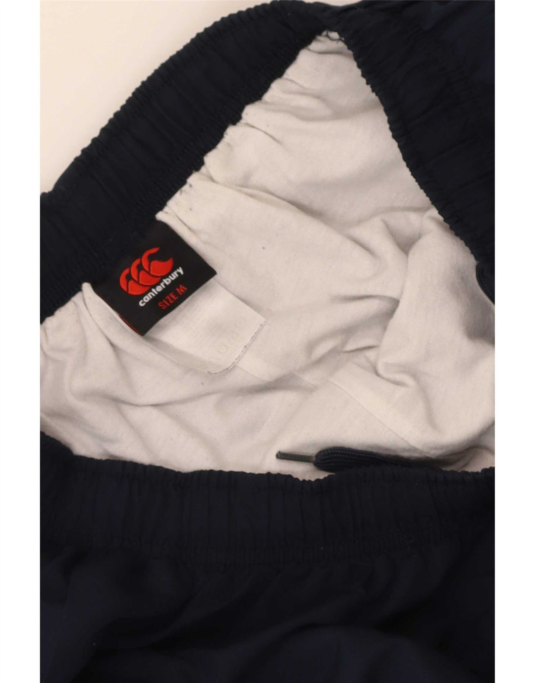 Calça de treino masculina Canterbury com estampa gráfica azul marinho médio poliéster