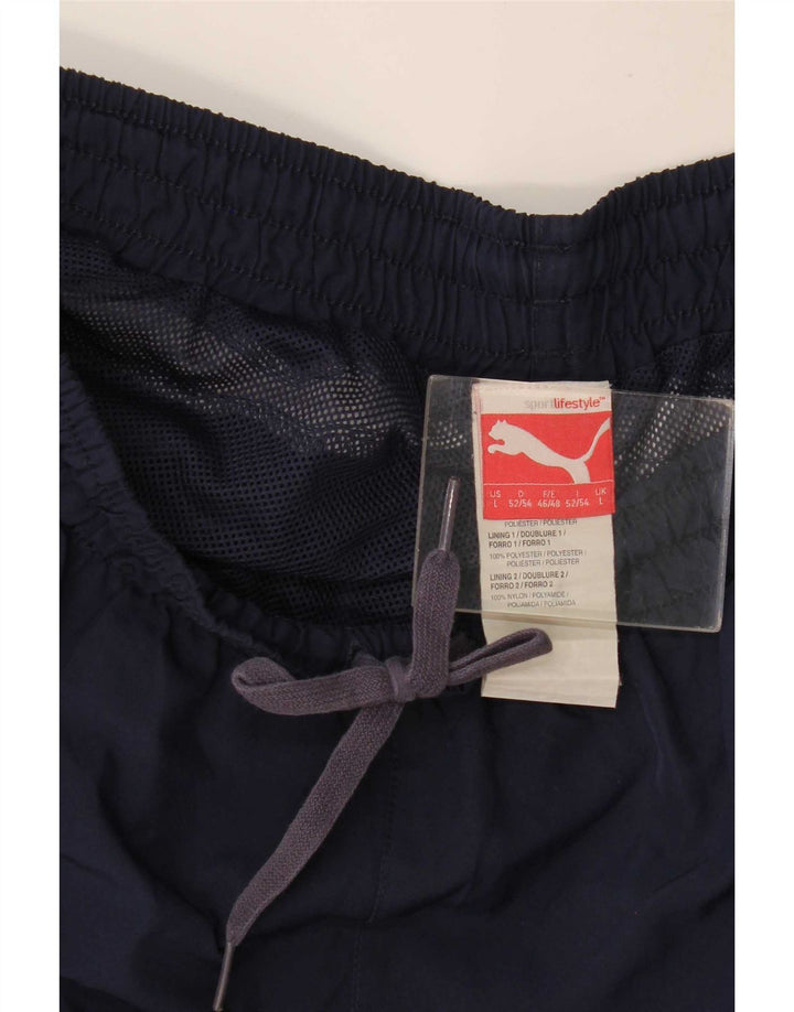 Calça de treino masculina Puma Graphic grande poliéster azul marinho