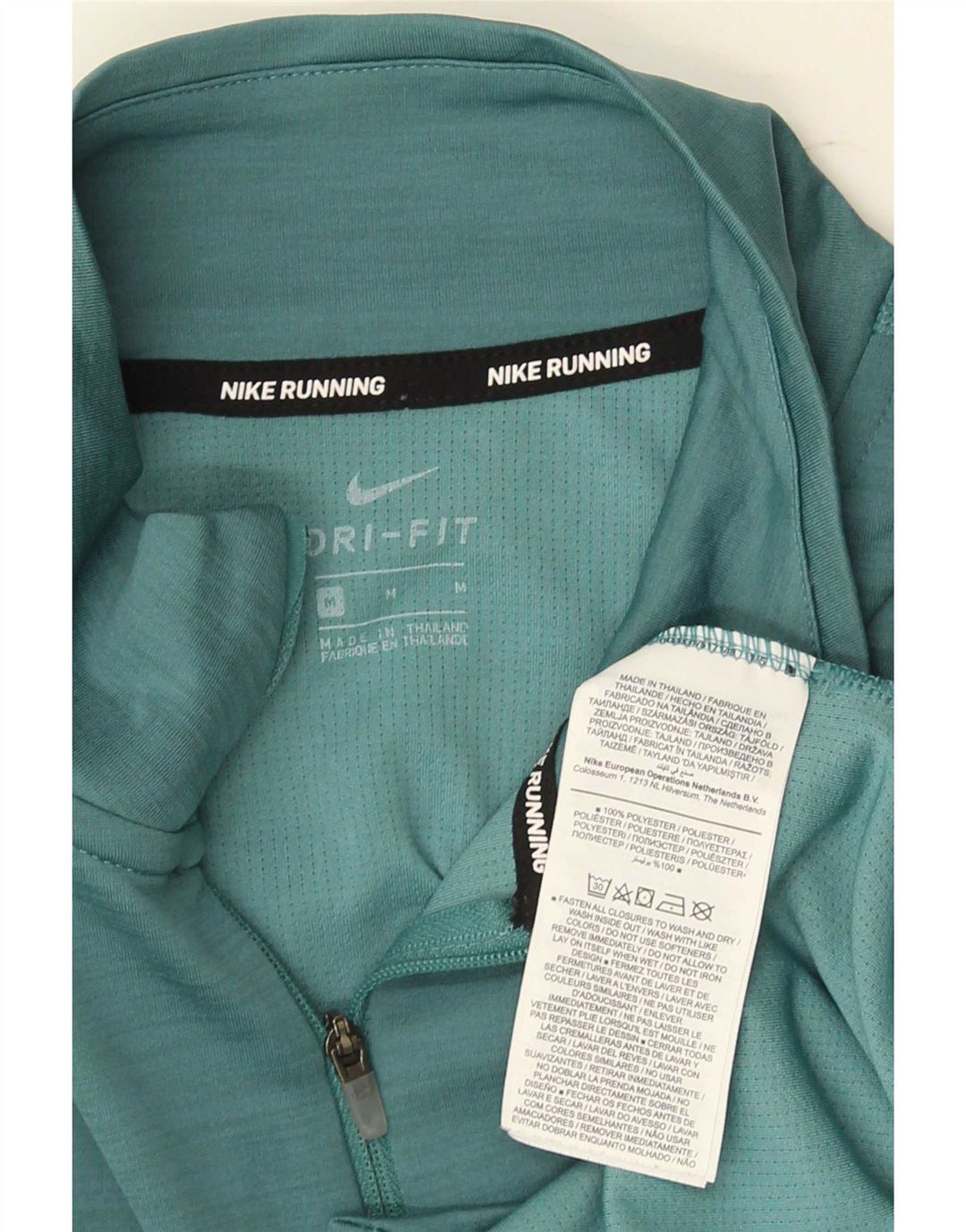 Top gráfico masculino Nike Dri Fit com decote em zíper manga comprida poliéster verde médio