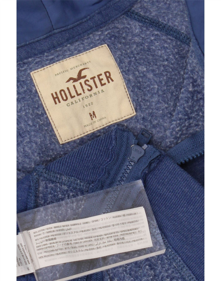 HOLLISTER Mens Graphic Zip Neck Hoodie Jumper Medium Blue Cotton Vintage Hollister and Second-Hand Hollister from Messina Hembry 
