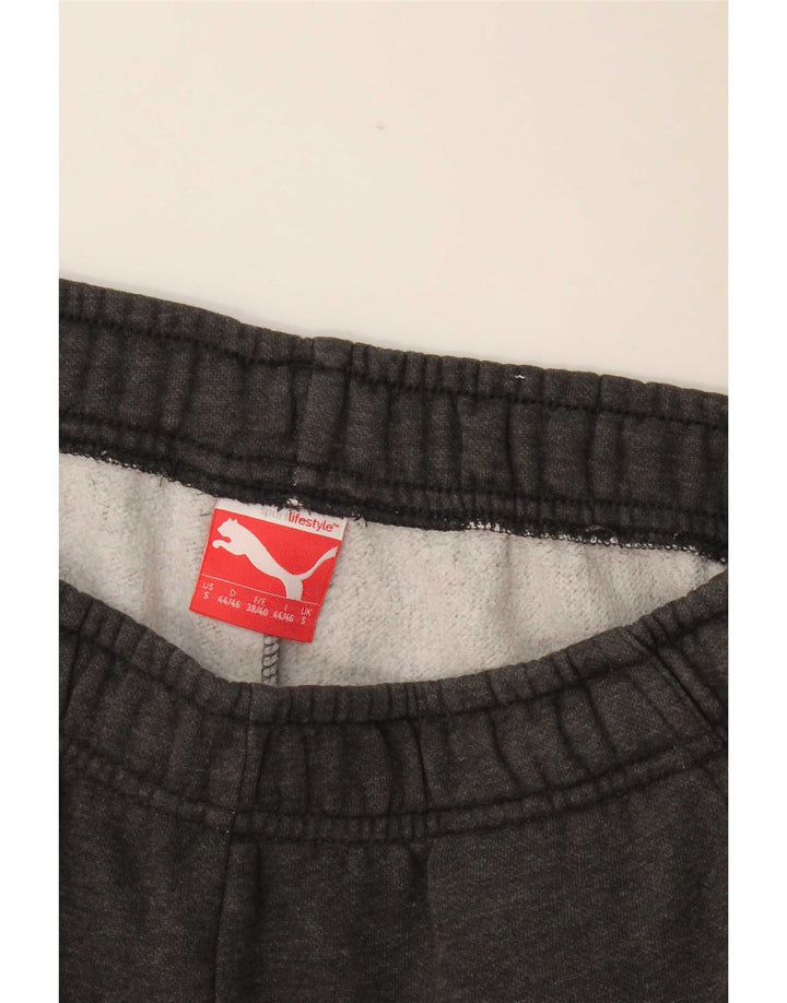 Calça esportiva masculina Puma Graphic Joggers pequena cinza manchada