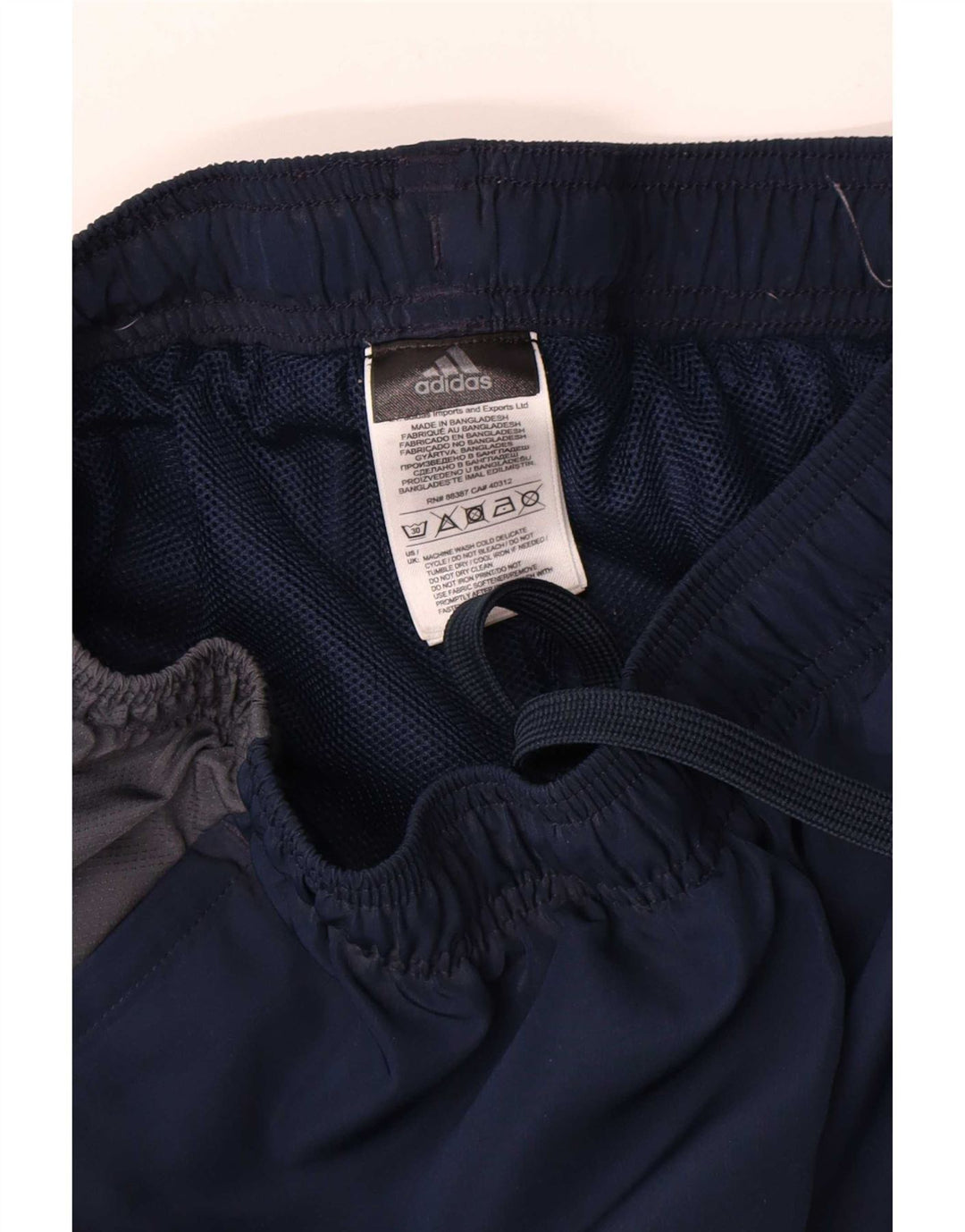 Calça de treino masculina Adidas médio azul marinho colorblock poliéster