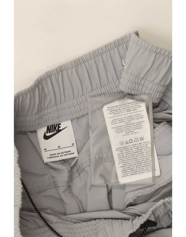 Calça de treino Nike masculina Graphic Cargo Joggers cinza médio nylon