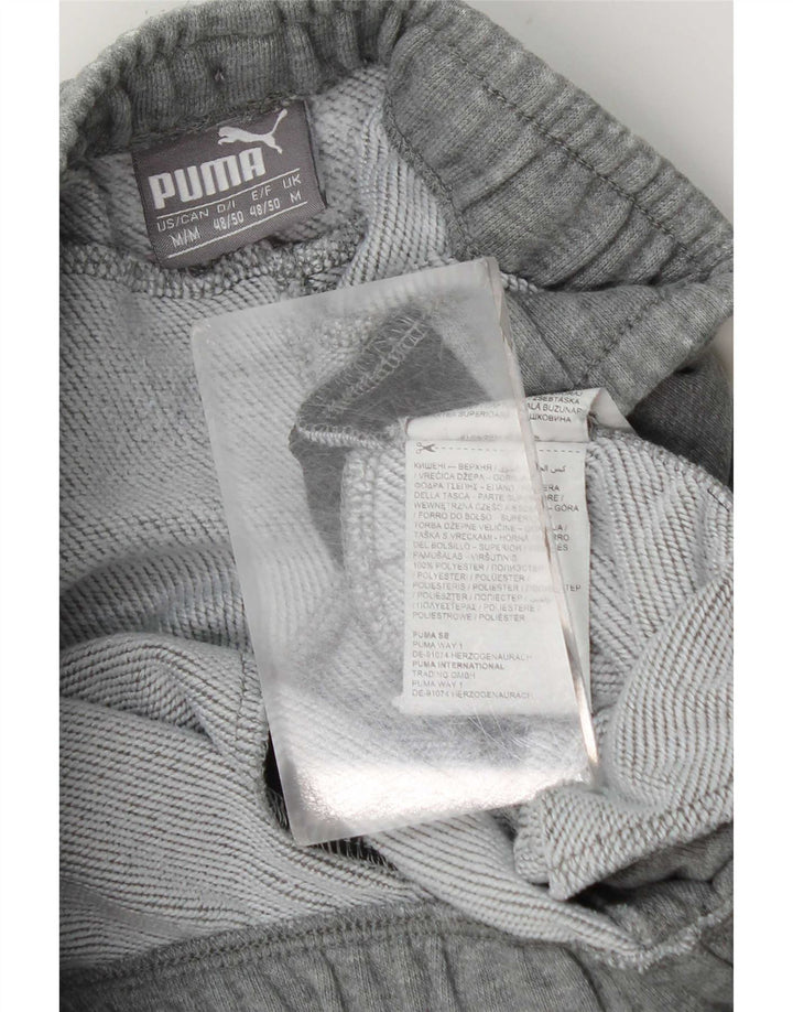 Calça esportiva masculina Puma Graphic Joggers cinza médio colorblock