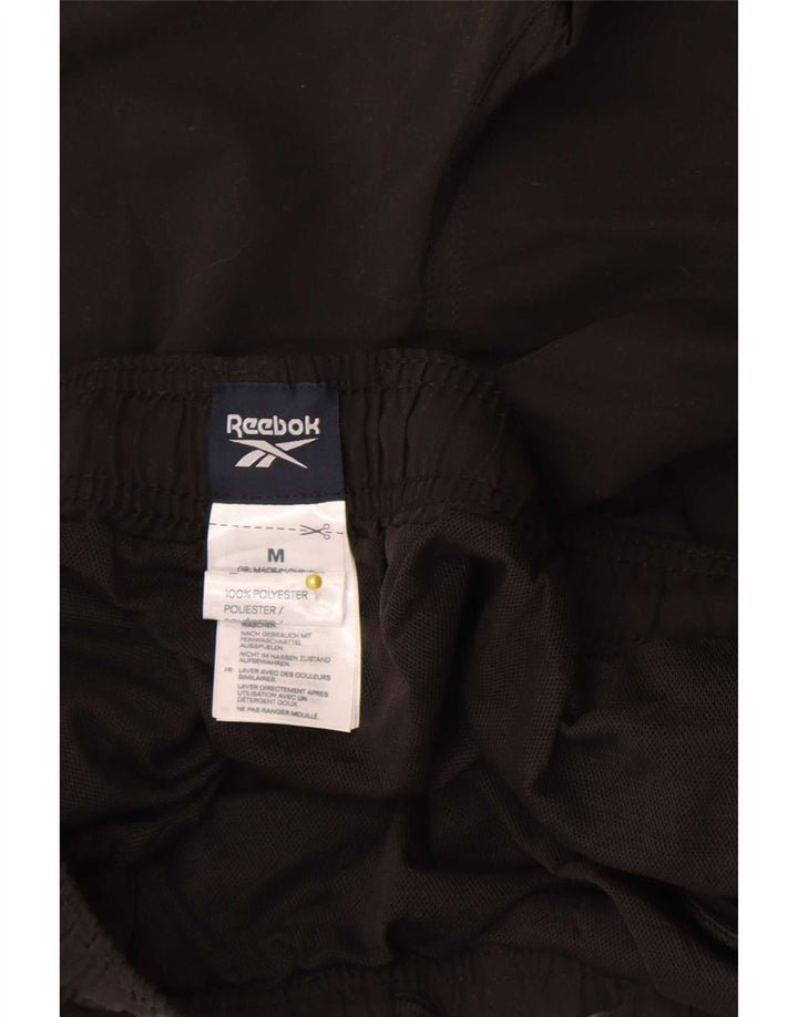 Shorts esportivos masculinos Reebok médio preto poliéster