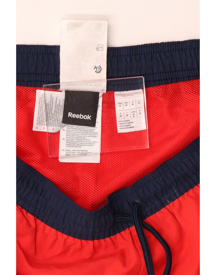 Shorts esportivos gráficos masculinos REEBOK poliéster vermelho médio
